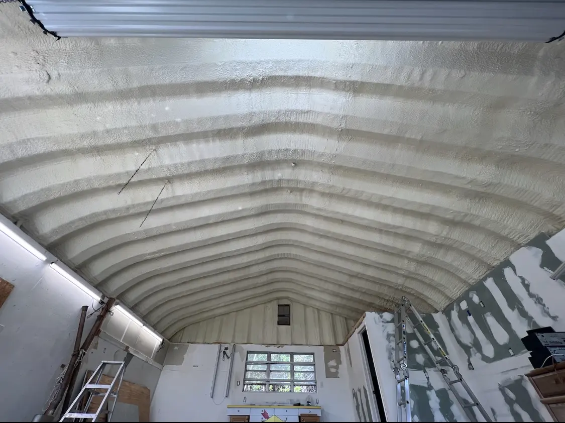 Spray polyurethane foam applied to the underside of a metal roof deck in Colleyville